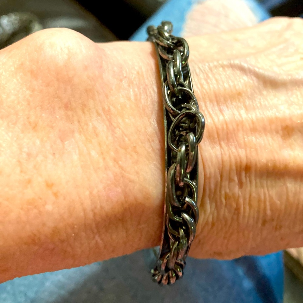 Silver-tone metal bangle bracelet with chain detail